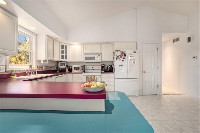 kitchen featuring white cabinetry, white appliances, sink, and high vaulted ceiling