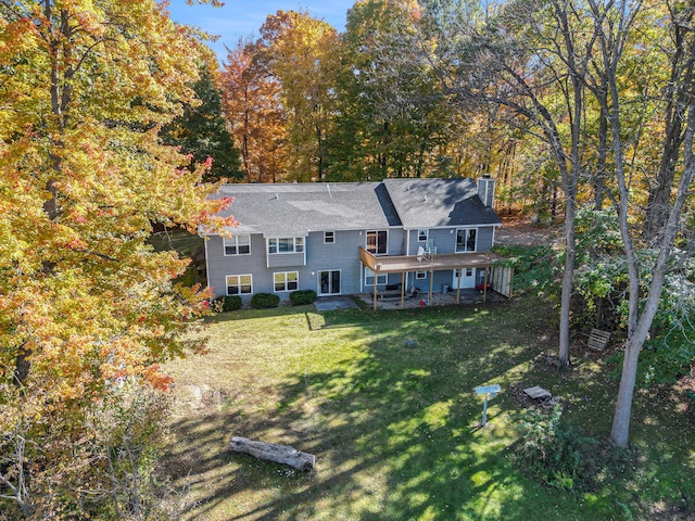 rear view of house with a lawn