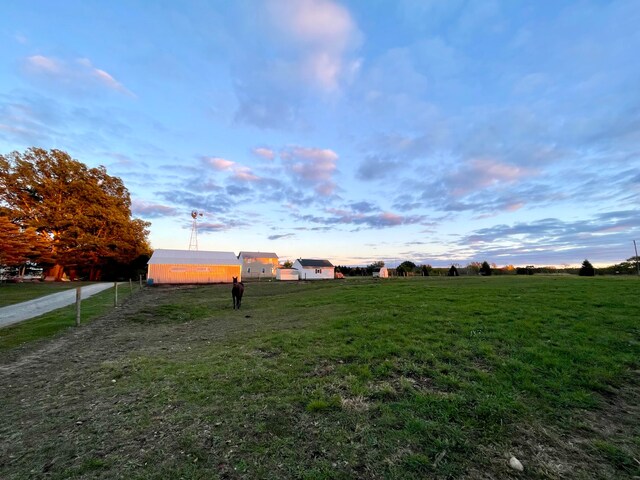 view of yard at dusk