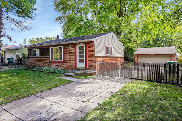 ranch-style house featuring an outbuilding, a garage, and a front lawn