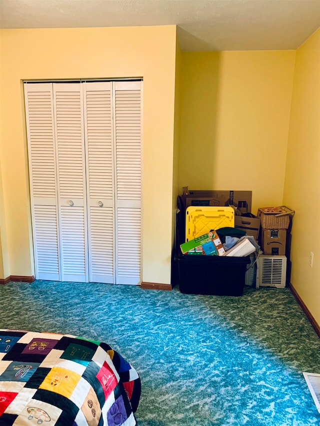 carpeted bedroom featuring a closet