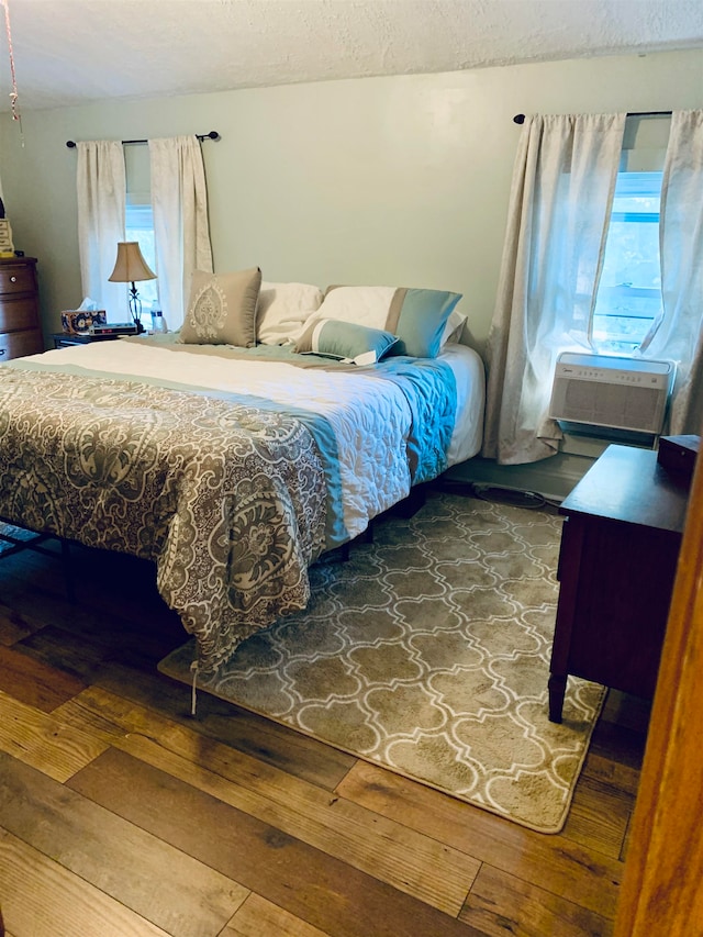 bedroom featuring cooling unit and wood-type flooring