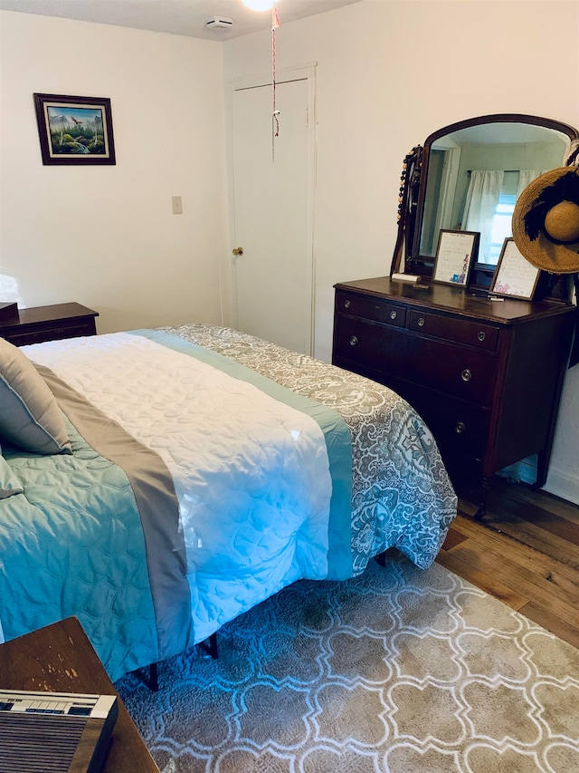 bedroom featuring a closet and wood-type flooring