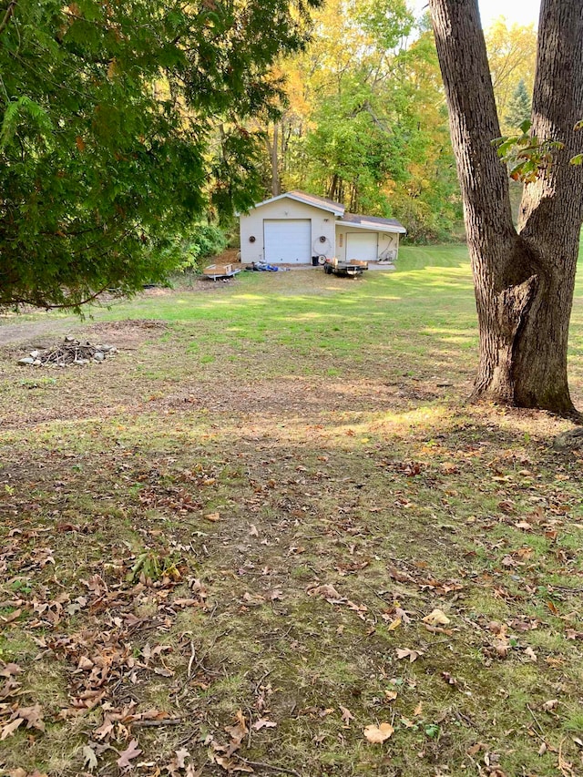 view of yard featuring a garage