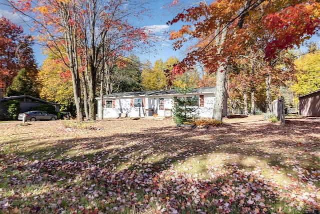 ranch-style home featuring a carport