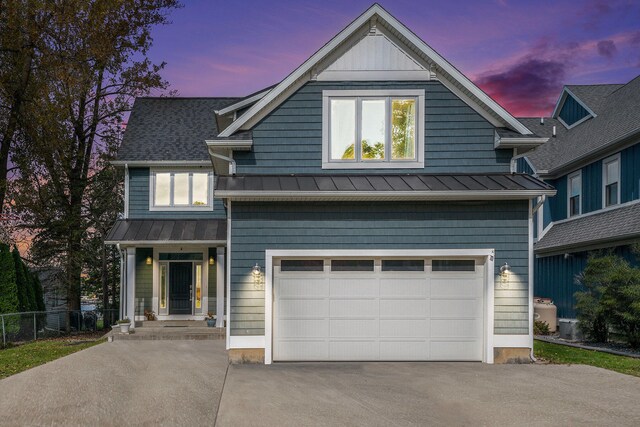 view of front of property featuring a garage