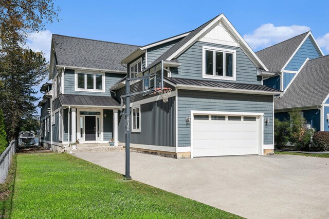 view of front of home featuring a garage and a front yard