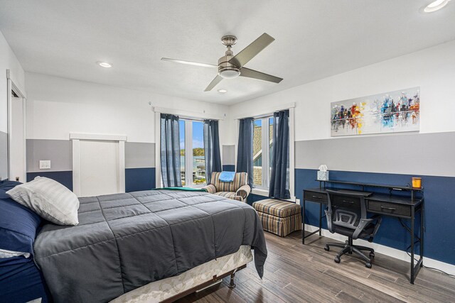 bedroom featuring ceiling fan and hardwood / wood-style floors