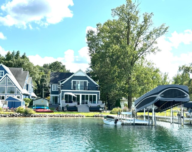 exterior space featuring a water view and a balcony