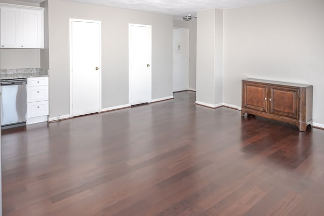 interior space featuring dark hardwood / wood-style floors and a textured ceiling