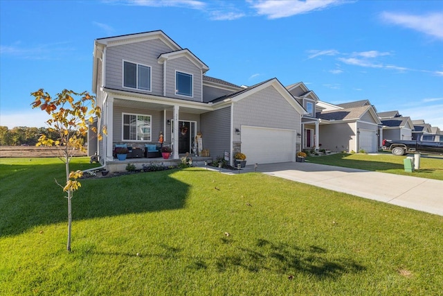 view of front of home featuring a front yard, a porch, and a garage