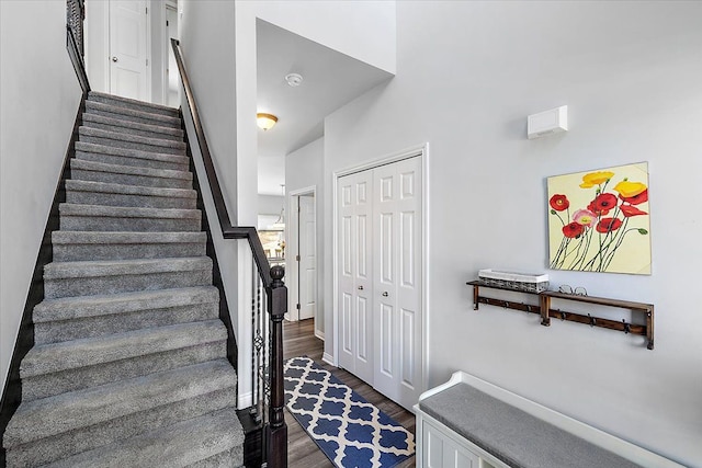 stairs featuring hardwood / wood-style flooring