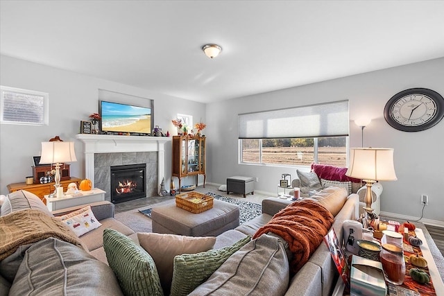 living room with a tile fireplace