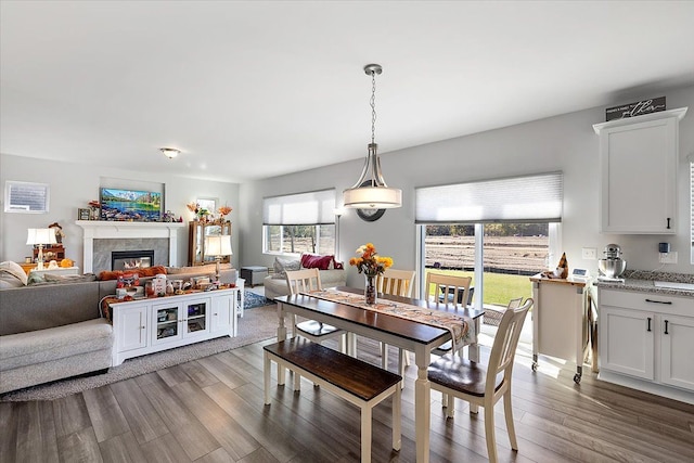 dining space with wood-type flooring