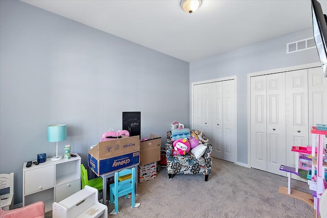 game room featuring light carpet