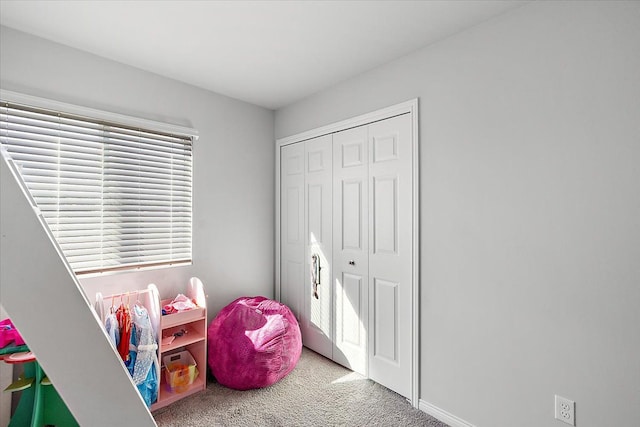 game room featuring light colored carpet