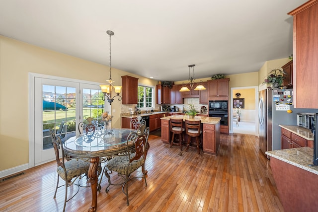 dining space featuring a chandelier and hardwood / wood-style flooring