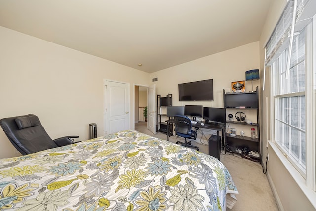 bedroom with light colored carpet