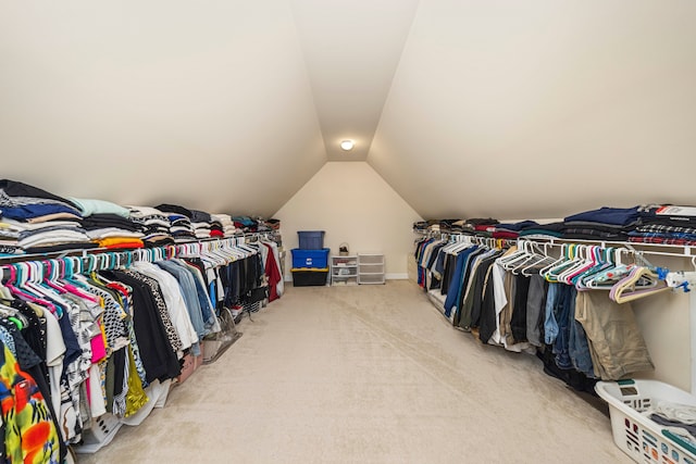 spacious closet featuring carpet and lofted ceiling