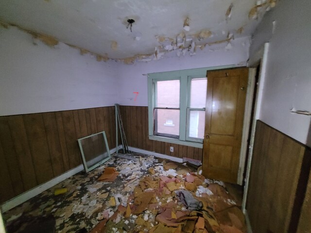 4824 Cortland St, Detroit, MI 48204 - unfurnished room featuring wainscoting and wooden walls