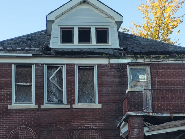 4824 Cortland St, Detroit, MI 48204 - view of home's exterior featuring brick siding and a shingled roof