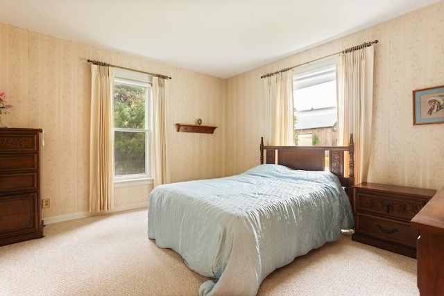 bedroom with light colored carpet