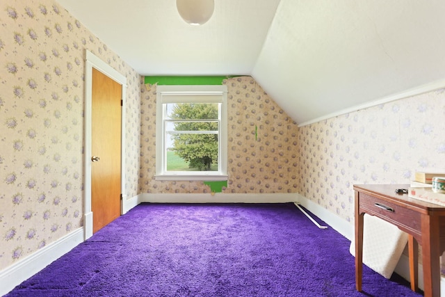 additional living space featuring lofted ceiling and carpet floors