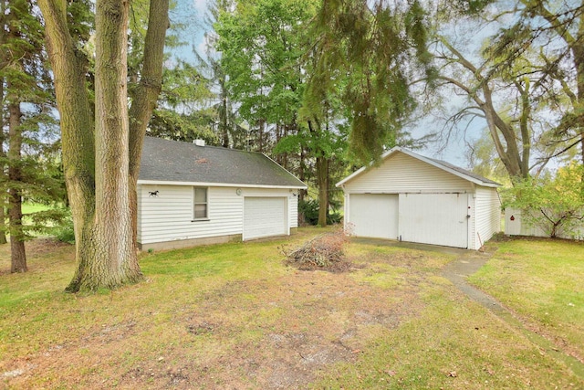 garage featuring a lawn