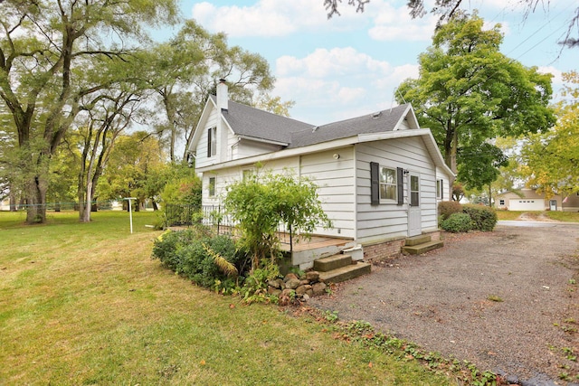 view of home's exterior with a lawn