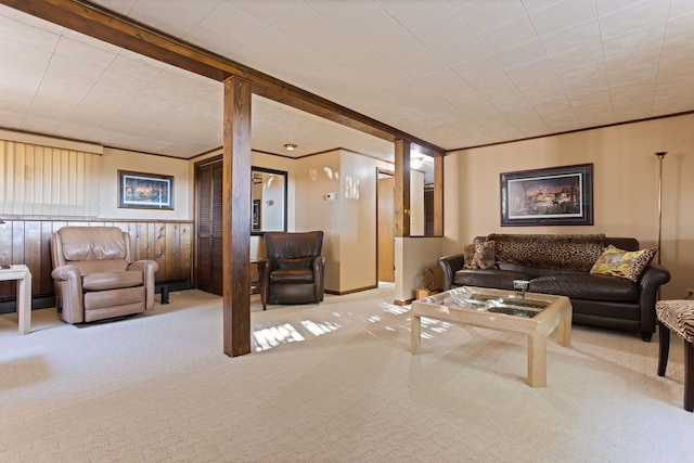 living room featuring crown molding and light colored carpet