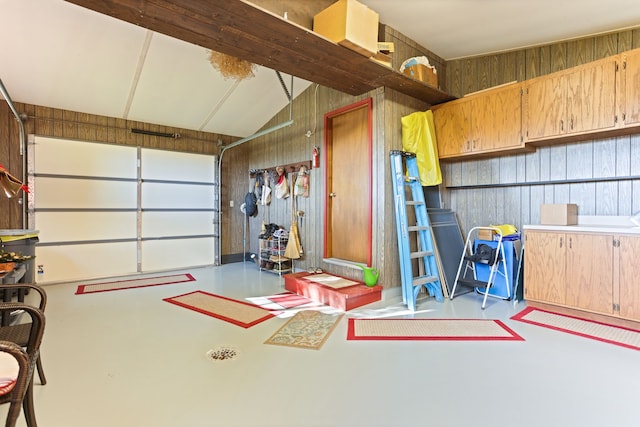 garage with wood walls