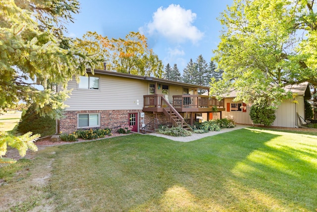 view of front of property with a front yard and a wooden deck