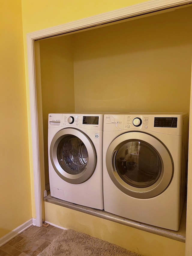 washroom featuring independent washer and dryer