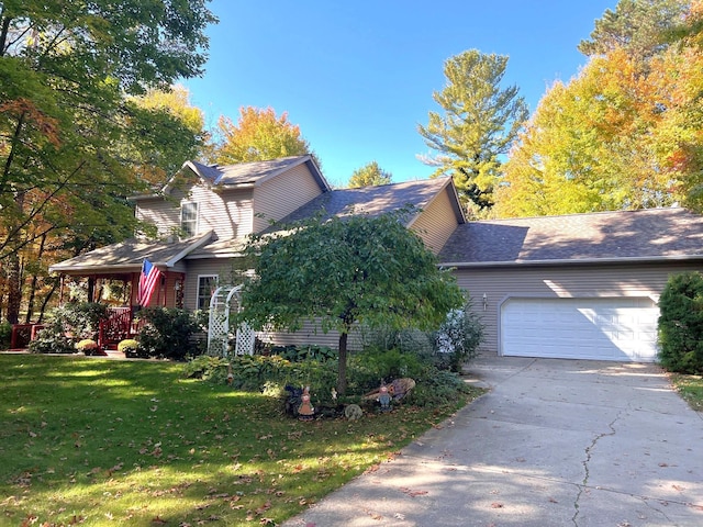 view of front of property featuring a garage and a front yard