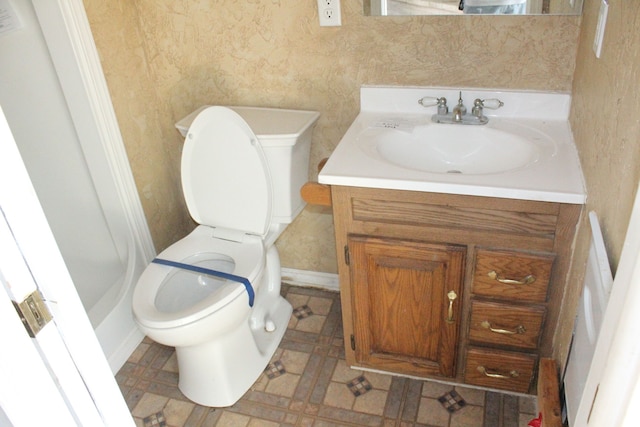 bathroom featuring vanity and toilet