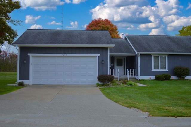 ranch-style home with a porch, a front yard, and a garage