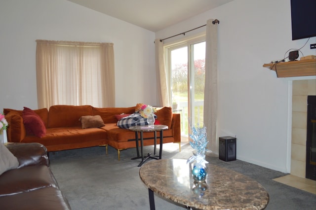 living room with carpet and vaulted ceiling