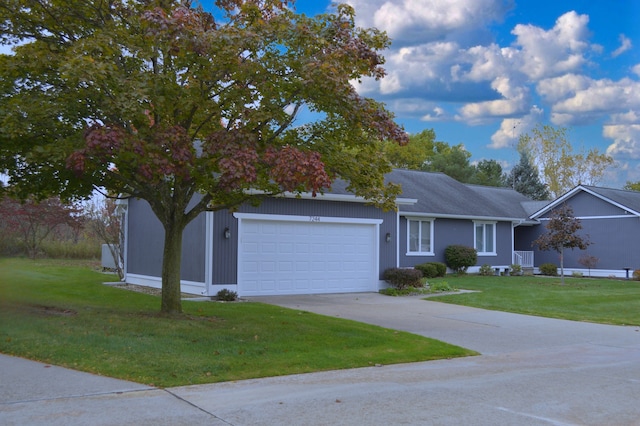 view of front facade featuring a front yard and a garage