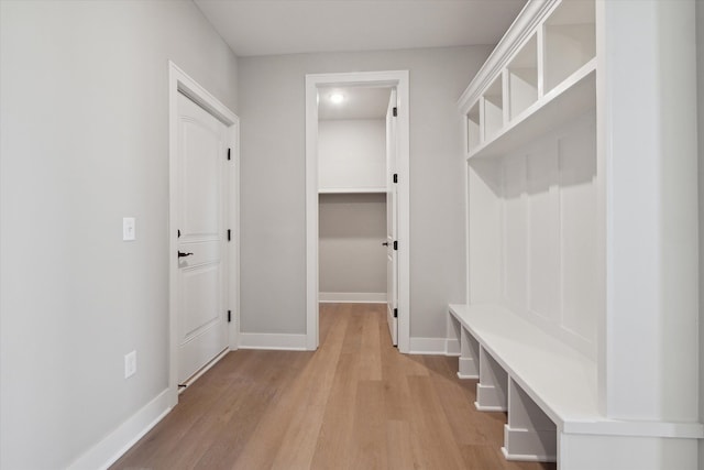 mudroom with light hardwood / wood-style flooring