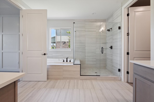 bathroom featuring vanity and plus walk in shower