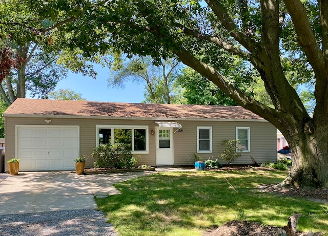 single story home with a garage and a front yard