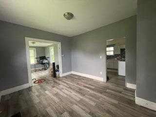 unfurnished dining area featuring hardwood / wood-style floors