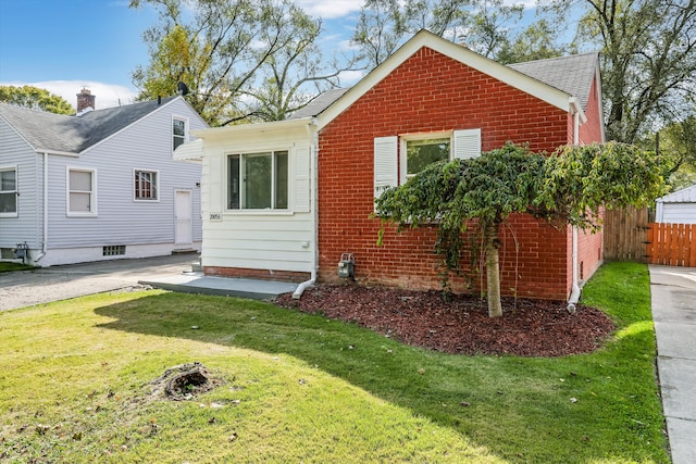 bungalow with a front yard