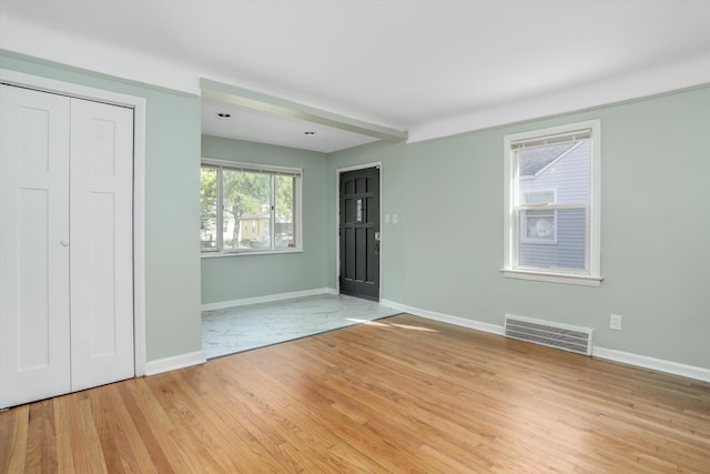 entryway with light hardwood / wood-style floors