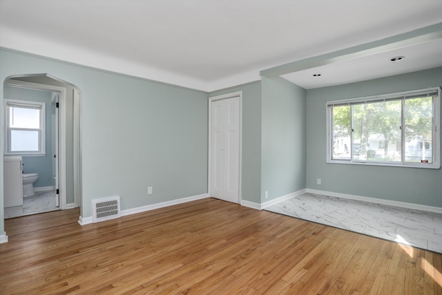 unfurnished room with light hardwood / wood-style flooring