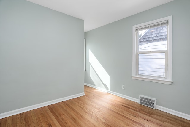 spare room featuring light hardwood / wood-style flooring