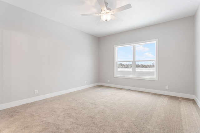 carpeted empty room with ceiling fan