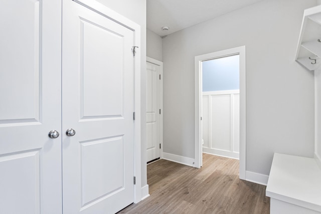 hall with light hardwood / wood-style floors