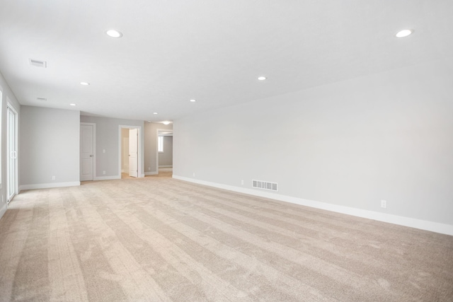 unfurnished room with light colored carpet