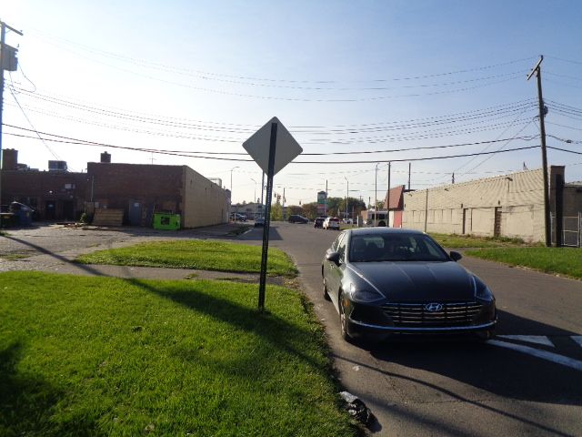 14390 Lappin St, Detroit, MI 48205 - view of asphalt street with traffic signs